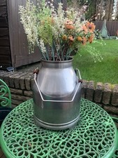 A pair of vintage milk buckets