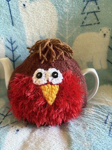 New hand knitted robin - hand,