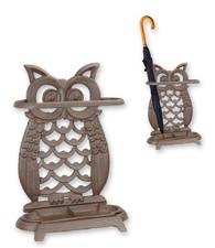 A cast iron owl umbrella stand