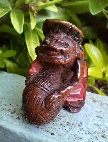 Netsuke daikoku man with bale - man,