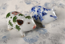 pair of small floral decorated pigs ceramic/china/porcelain?