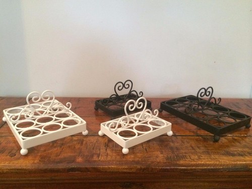 Cast iron egg holder - or,