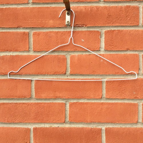 White wire hangers suit - x,