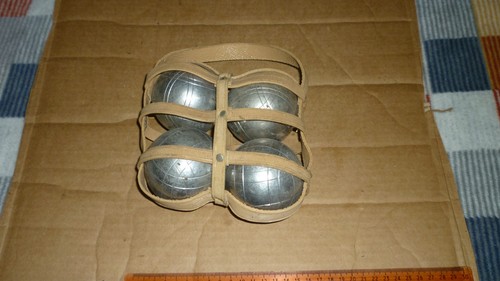 Four vintage metal pétanque