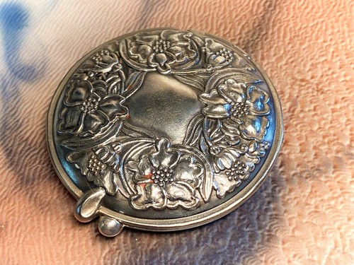 Floral embossed silver tone