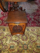 oak Arts & Crafts podium with carved floral decoration
