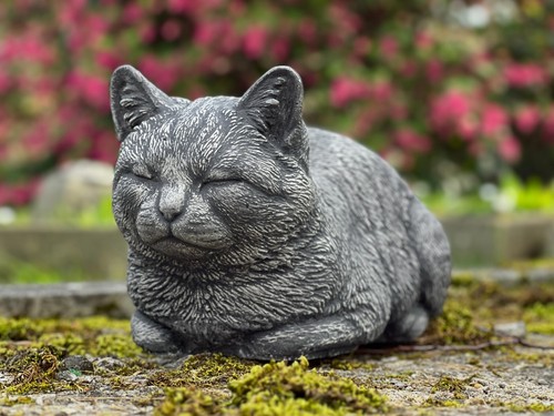 Stone sleeping cat sculpture