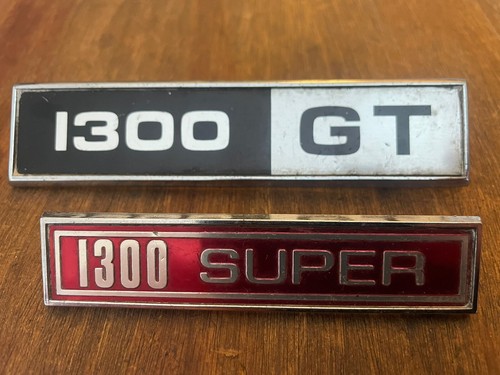 Two vintage car badges - badges,