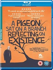 A PIGEON SAT ON A BRANCH