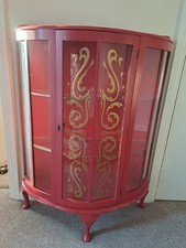 Antique bow front display cabinet with glass doors and gold detail