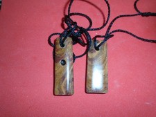 2 maori style onyx pendants -
