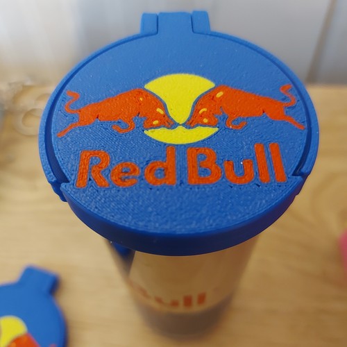 Red bull can lids - can,