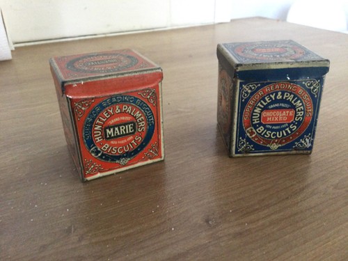 Two miniature advertising tins