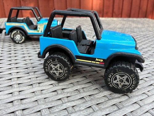 Two vintage buddy jeeps with - two,