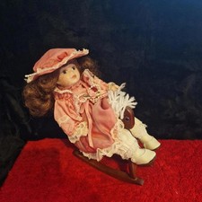 Leonardo Porcelain Doll on Rocking Horse – Pink Dress & Bonnet Display