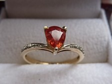 Rocks & Co padparadscha sapphire and diamond ring. 9ct yellow gold. Size M .  