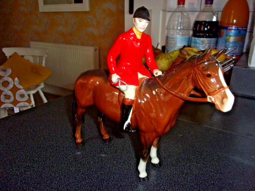 Beswick huntsman seated - seated, on