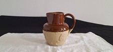 VINTAGE ROYAL DOULTON LAMBETH EMBOSSED BROWN STONEWARE JUG LEADLESS GLACE