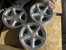 GENUINE FORD ESCORT COSWORTH ALLOYS WITH  AFTERMARKET GOOD QUALITY CAPS FIESTA