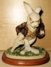 White Rabbit Figurine On Wood