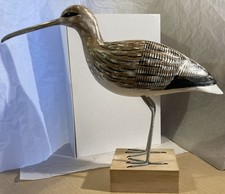 Wooden bird carving by