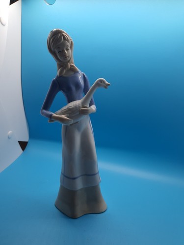 Lladro style girl with - ,