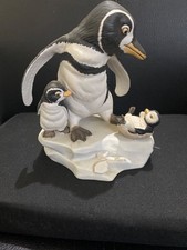 Penguin with chicks figure by