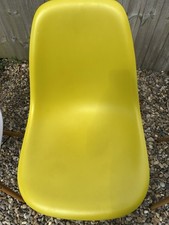 Original Charles Eames Chair In Three Different Colors.