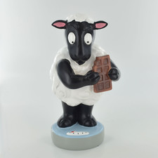 Comical Sheep Stepping On The Scales Whilst Nibbling Chocolate Figurine