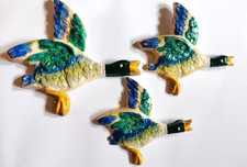 Flying ducks plaster wall