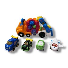 VTech Deluxe Car Carrier and 4 Go Go Smart Wheels Vehicles Bundle