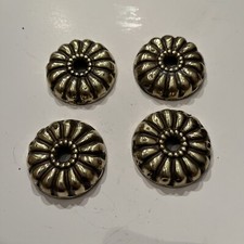 Four antique brass bed adornments