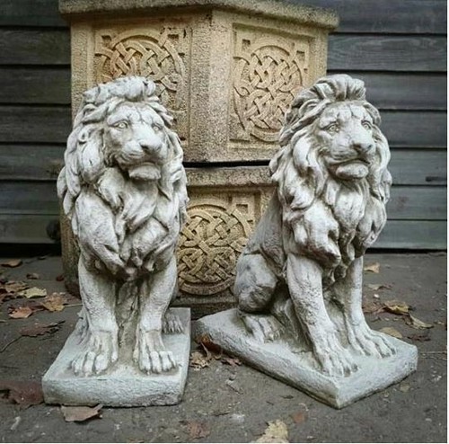 Pair lion statues - of,