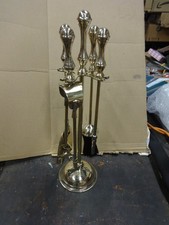 A Large Brass Fireside Companion Set