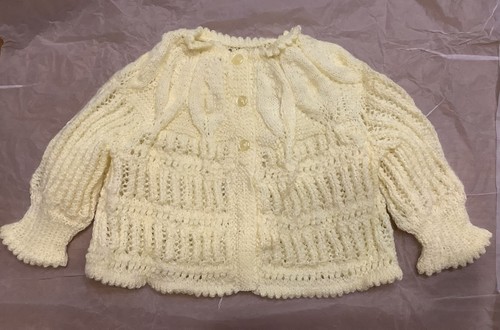 Lovely hand knitted baby - hand,