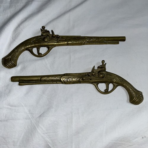 1970s brass pair duelling - of,