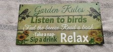 Green wooden garden sign