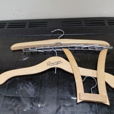 Three vintage wooden clothes