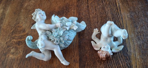 Capodimonte tumbling putti and
