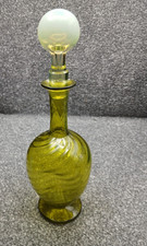 Vaseline glass decanter..Dimpled and swirled decoration.Hand blown.RARE