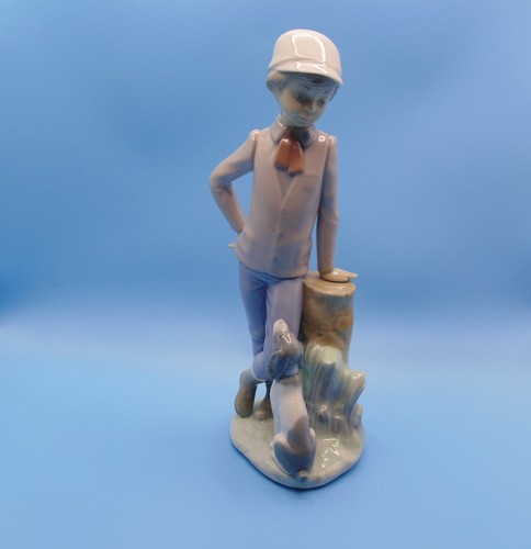 Nao lladro boy with - by, dog