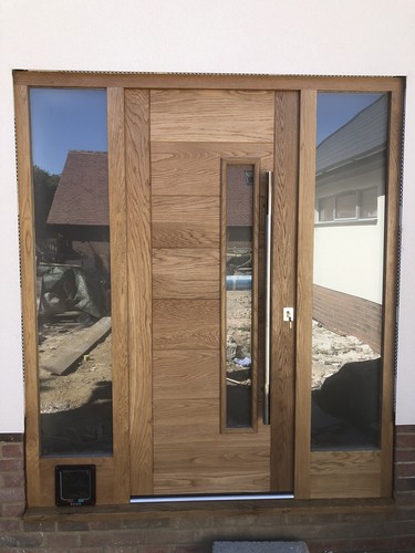 Modern solid oak front door - front,