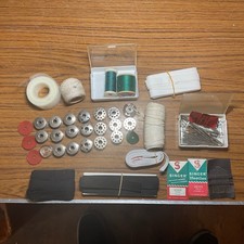 A Collection Vintage Sewing Machine Needles Spools Reels Cottons Ribbons Binding