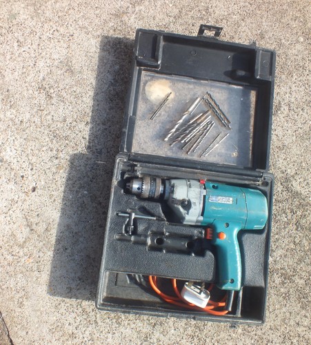 Mains powered electric drill - powered,