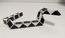 Vintage Rubiks Twist 1980s Magic Snake Puzzle Plastic Toy, Black and White