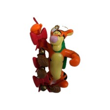 Disney Winnie the Pooh and Friends TIGGER Holding Ribbon Bells & Acorns 3.75"