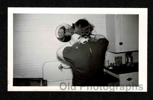 Kitchen sink woman fixing hair - sink,