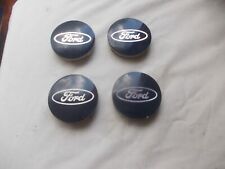 FORD BLUE ALLOY WHEEL CENTRE CAPS,SET OF 4 ,60 MM DIAMETER (ALL WHEELS)