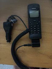 Vintage Nokia 3110 classic mobile phone And a car charge