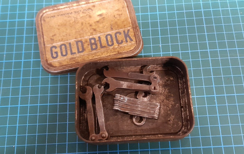 Old tobacco tin with points - old,